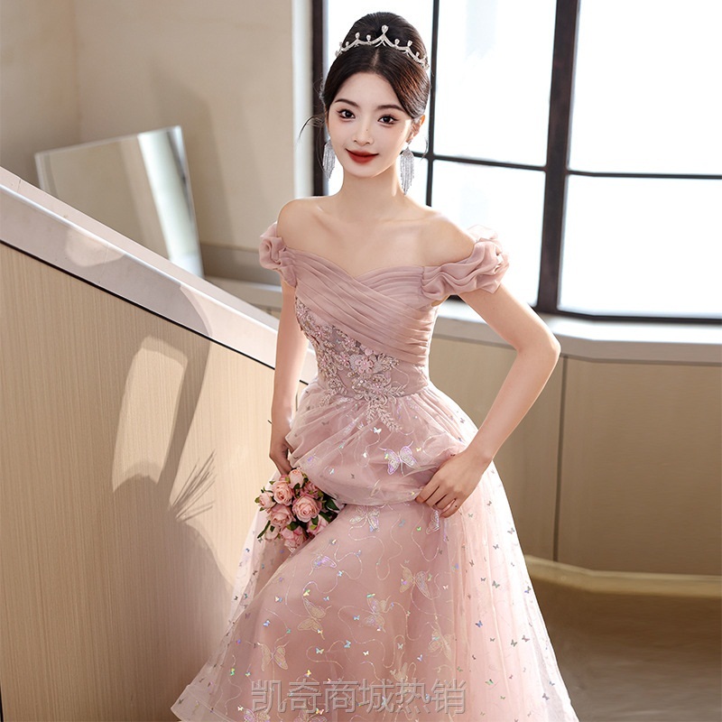 一字肩粉色亮片晚礼服裙2024新款法式轻奢小众主持人订婚敬酒服女