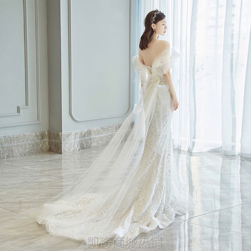 鱼尾轻婚纱裙2024新款秋冬新娘一字肩旅拍小拖尾婚纱年会主持礼服